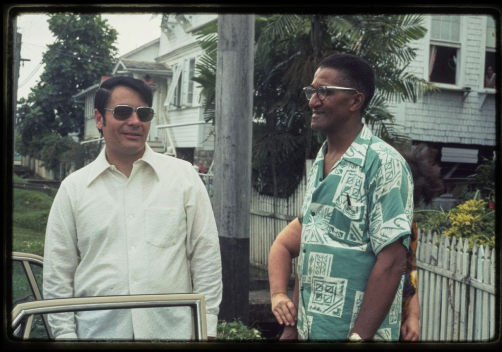 Archie Ijames standing next to Jim Jones